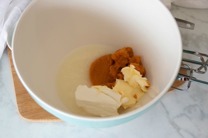Blend cream cheese, butter, puréed pumpkin and coconut oil.